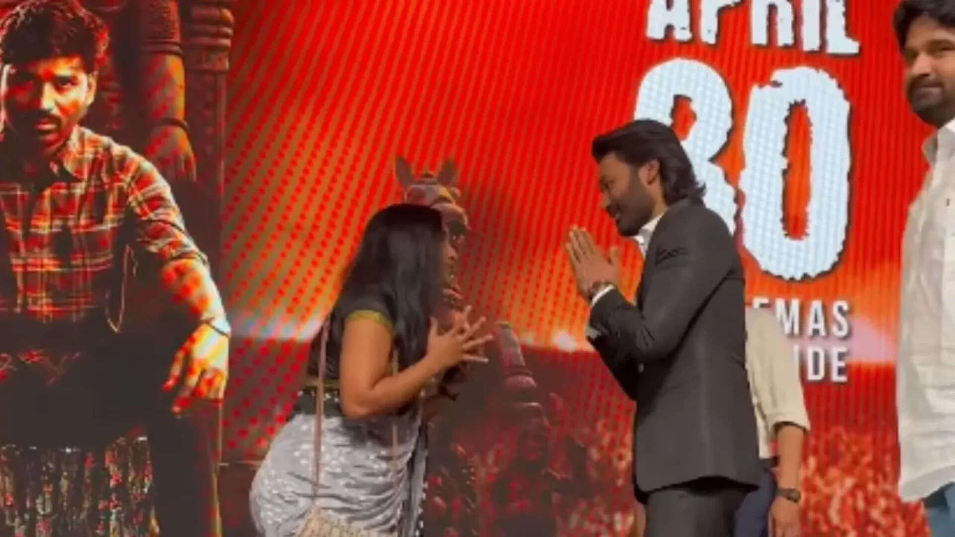Dhanush fan moment at 'Kara' event; Female fan kneels